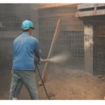Illustration du béton projeté, accompagné des fascicules Asquapro mettant en valeur des techniques avancées de construction.